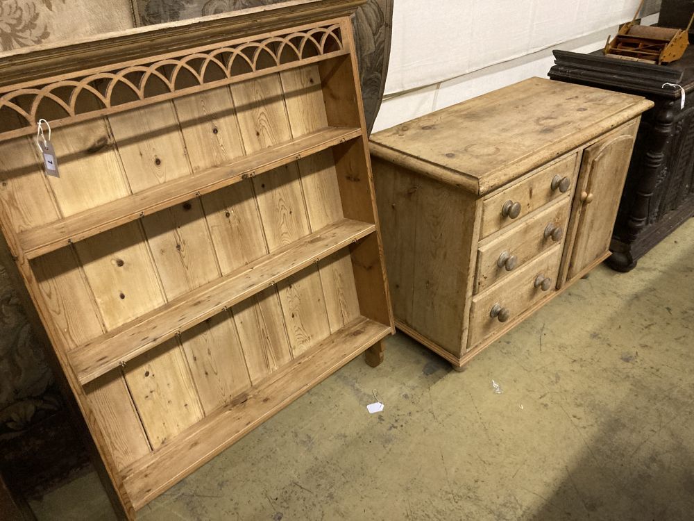 A Victorian pine dresser base, together with a panelled pine plate rack, base width 107cm, depth 50cm, height 80cm